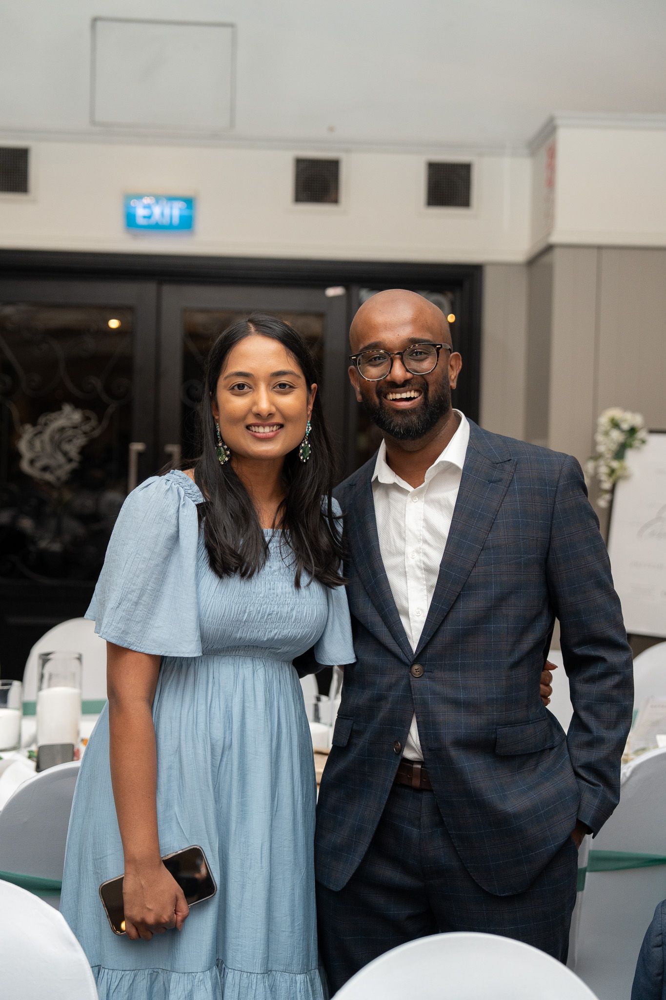 Couple posing together at wedding reception entrance at Bracu Estate South Auckland elegant Indian wedding photography portrait