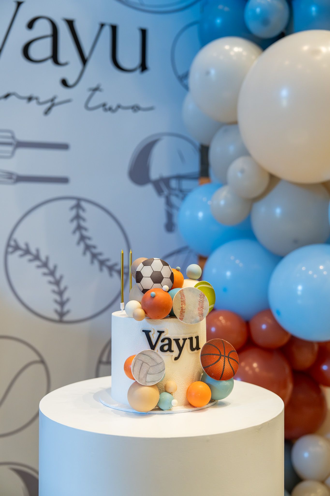 Sports-themed birthday cake on display at Vayu’s second birthday in the Razzle Dazzle Room at Naumi Auckland Airport Hotel in Auckland